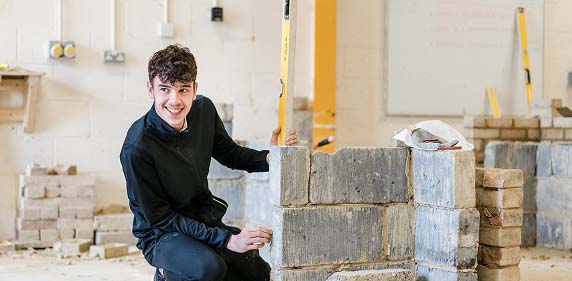 Harrogate College student laying bricks in the technology centre